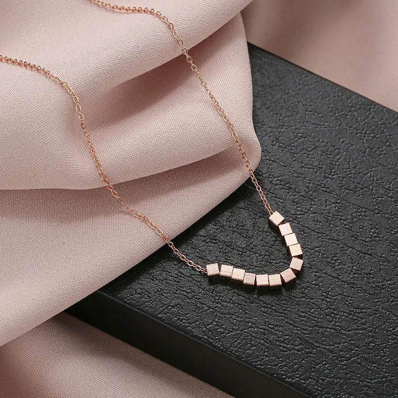 Wealth Comes From Every Direction, Ten Squares Necklace