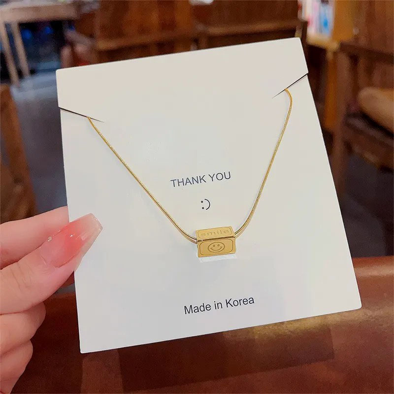 geometric with smiley, stainless steel necklace