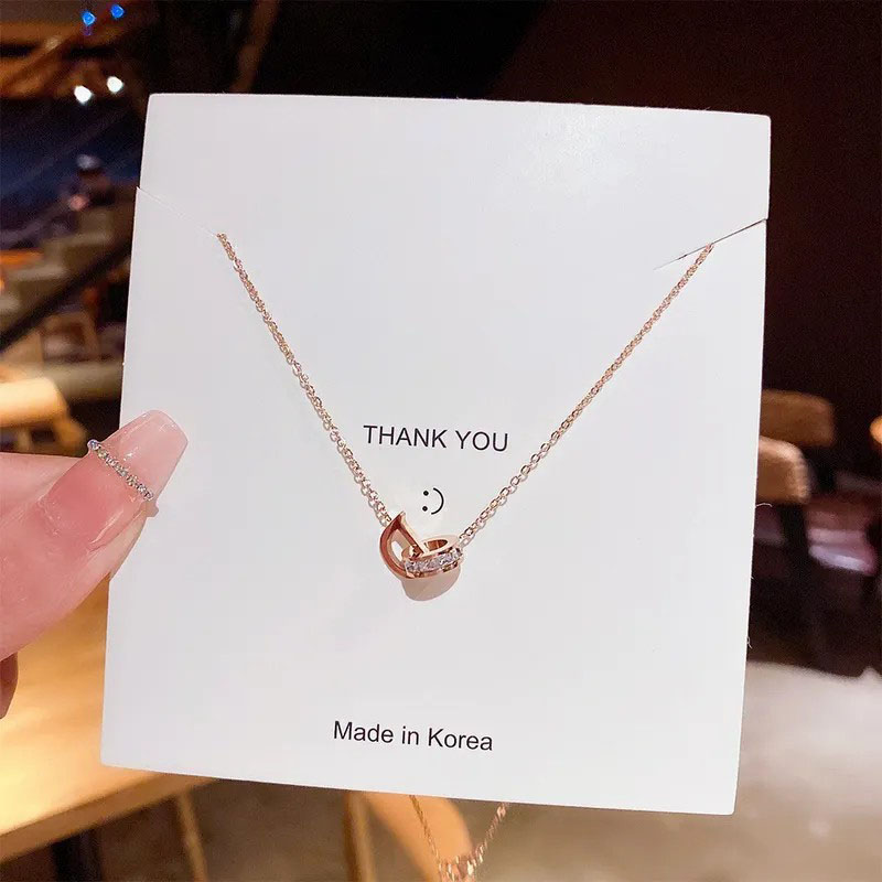 round and D letter interlocking, stainless steel necklace