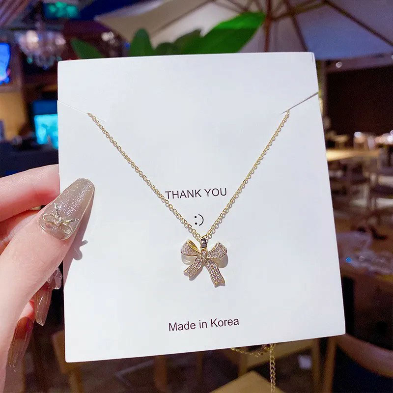 rhinestone inlaid, bowknot pendent, stainless steel necklace