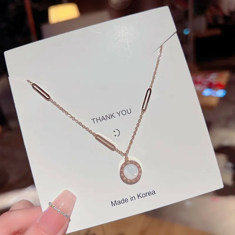 round, roman numerals, shell inlaid, stainless steel necklace