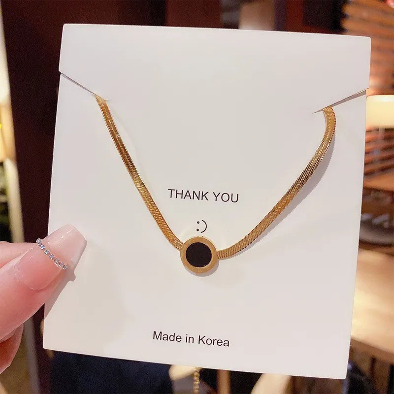 round, black shell stainless steel necklace