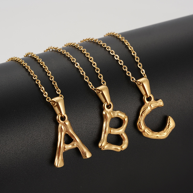 initial letter, gold necklace