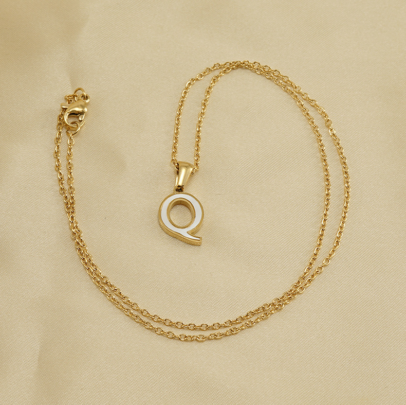 initial letterr, white shell, gold necklace