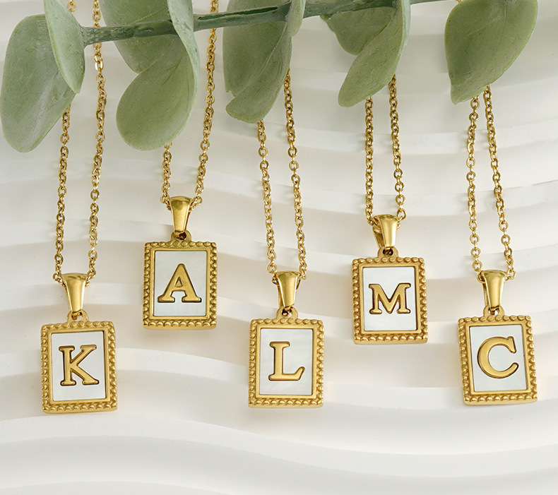 white shell, gold pendant