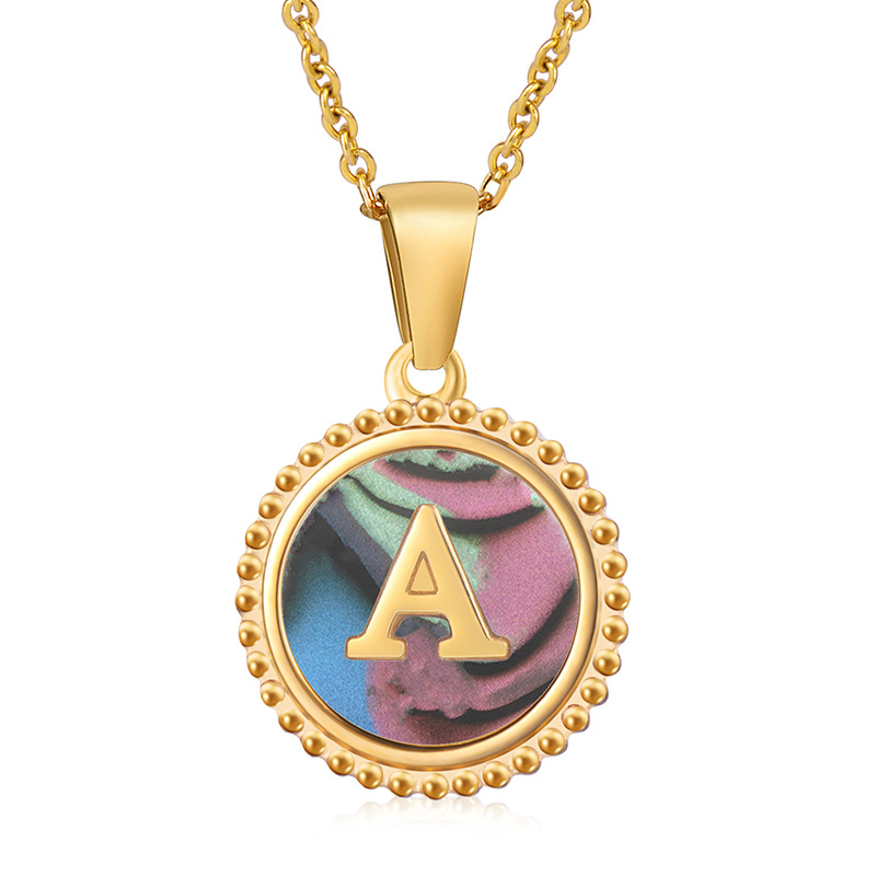 black shell charms, initial letter